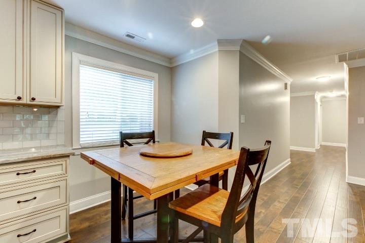 521 Ranch Farm Road Raleigh, NC 27603 - Photo 16 of 30 a view of a dining room with furniture and window