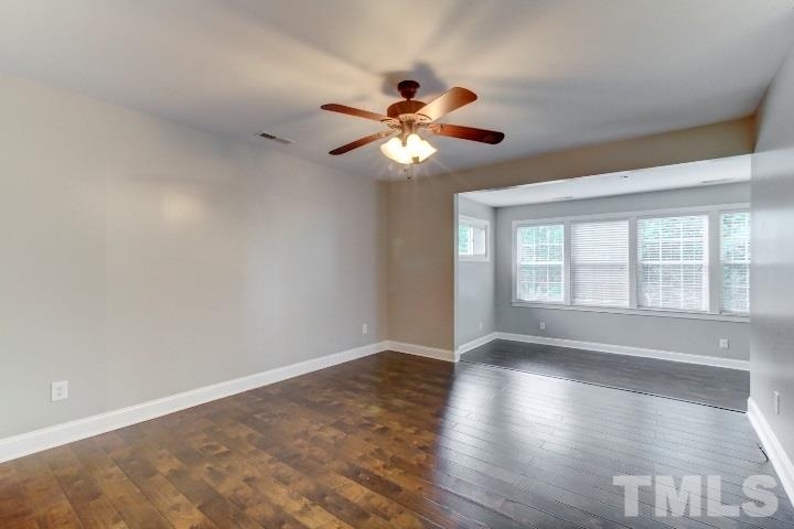 521 Ranch Farm Road Raleigh, NC 27603 - Photo 18 of 30 a view of an empty room with window and chandelier fan