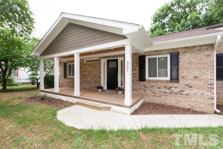 521 Ranch Farm Road Raleigh, NC 27603 - Photo 3 of 30 a front view of a house with garden