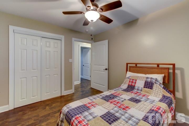 521 Ranch Farm Road Raleigh, NC 27603 - Photo 23 of 30 a bedroom with a bed and a chandelier