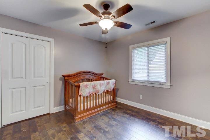 521 Ranch Farm Road Raleigh, NC 27603 - Photo 25 of 30 wooden floor in an empty room with a window