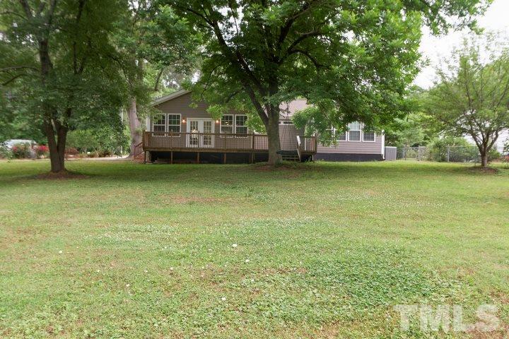 521 Ranch Farm Road Raleigh, NC 27603 - Photo 27 of 30 a view of a house with a garden