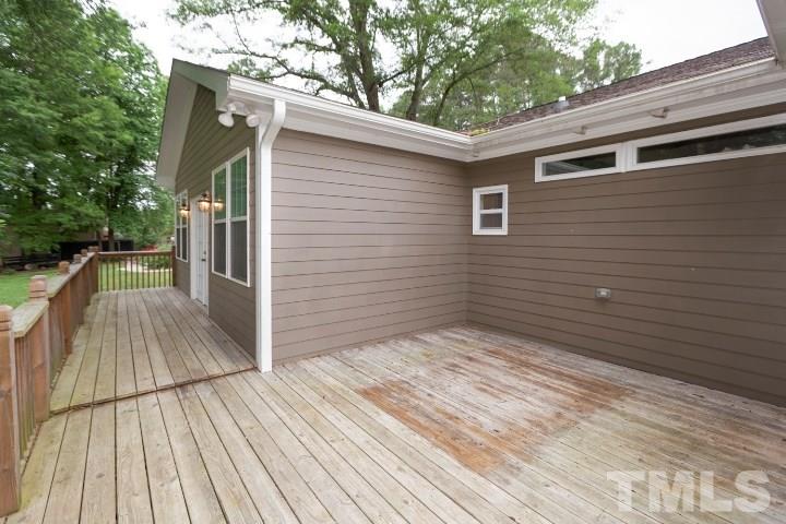 521 Ranch Farm Road Raleigh, NC 27603 - Photo 28 of 30 a view of backyard with a deck