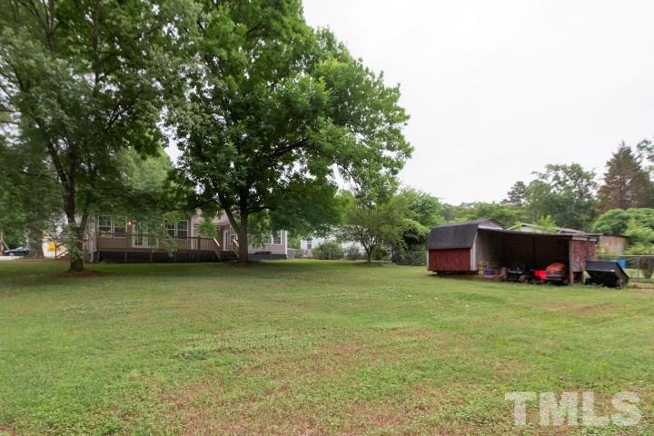 521 Ranch Farm Road Raleigh, NC 27603 - Photo 30 of 30 a view of a house with yard and sitting area
