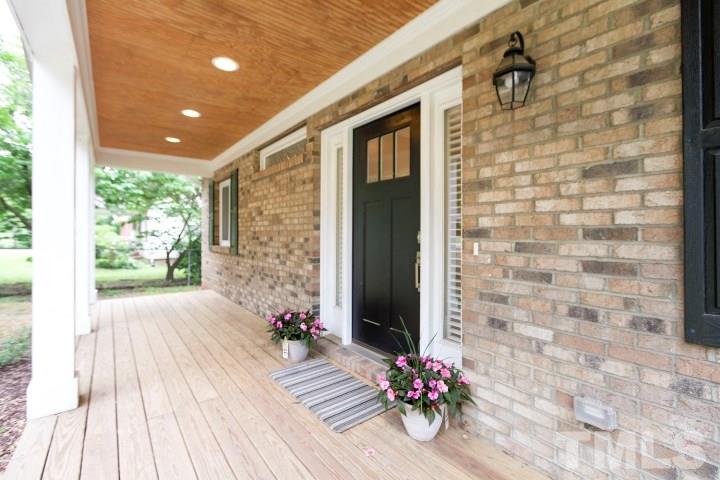 521 Ranch Farm Road Raleigh, NC 27603 - Photo 4 of 30 a view of a porch with wooden floor