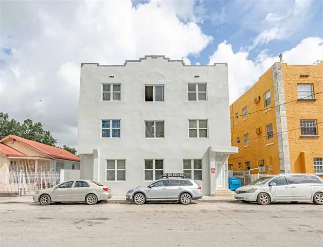 a car parked in front of a building