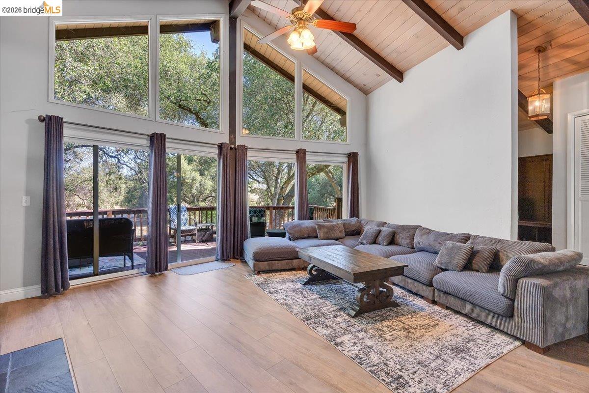 8733 Fraguero Road Sonora, CA 95370 - Photo 25 of 73 Vaulted ceiling with exposed wood beams and wood-finish paneling