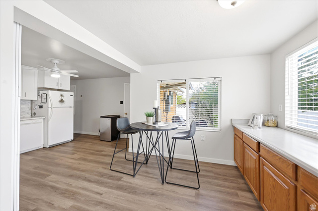 215 Carol Way Midvale, UT 84047 - Photo 6 of 30 Kitchen Dining area featuring light wood finished floors and a ceiling fan