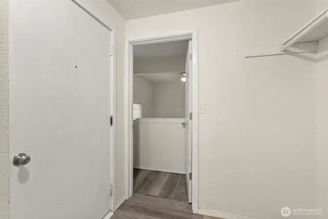 a bathroom with a granite countertop sink toilet mirror and shower