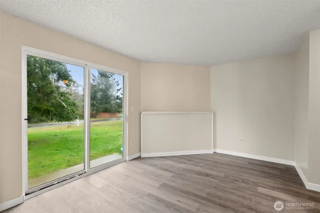 a view of staircase with wooden floor and white walls
