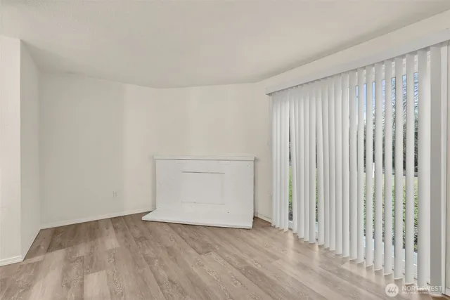 a kitchen with granite countertop a refrigerator and a sink