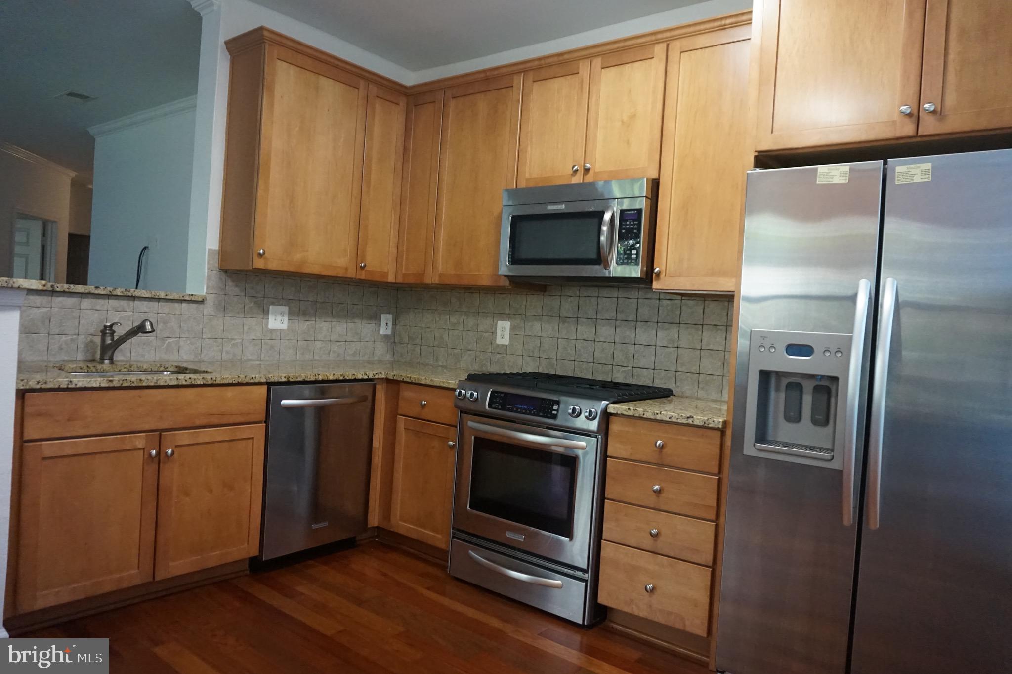11750 Old Georgetown Road, Unit 2135 Rockville, MD 20852 - Photo 6 of 30 Granite & Hardwood completes the kitchen