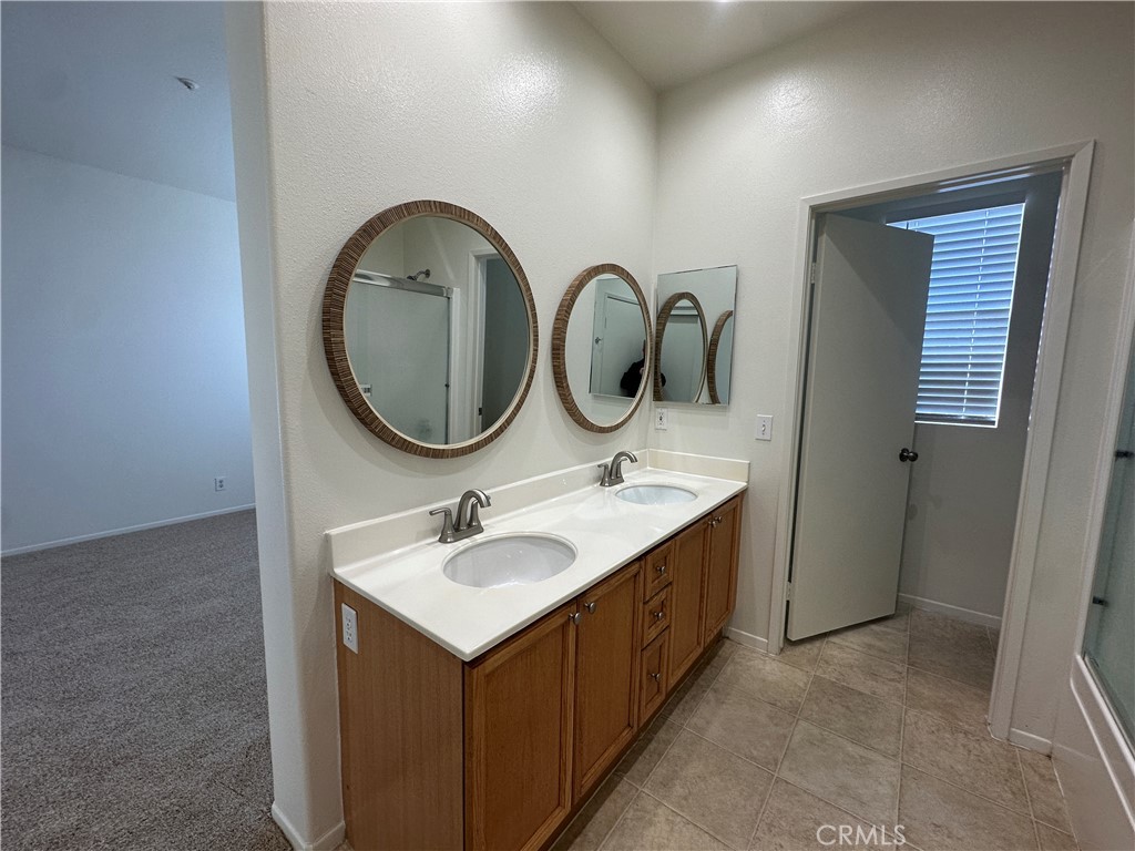 1760 Millpark Lane Simi Valley, CA 93065 - Photo 12 of 21 a bathroom with a sink and a mirror
