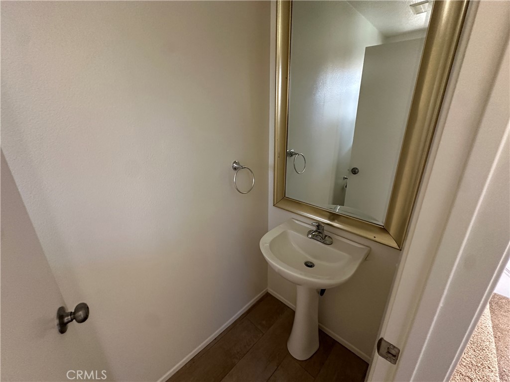 1760 Millpark Lane Simi Valley, CA 93065 - Photo 16 of 21 a bathroom with a sink and a mirror