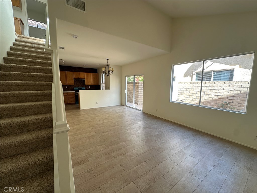 1760 Millpark Lane Simi Valley, CA 93065 - Photo 2 of 21 a view of an empty room with wooden floor and a window