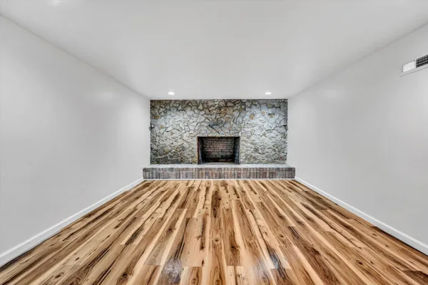 a view of wooden floor in an empty room