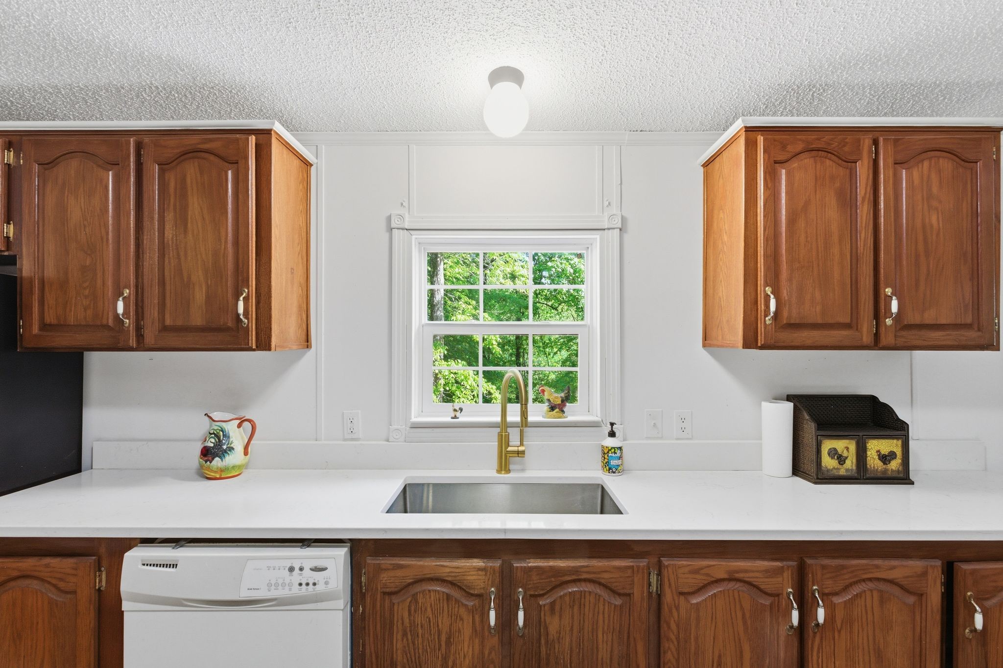 230 East Piney Road Dickson, TN 37055 - Photo 22 of 36 a kitchen with stainless steel appliances granite countertop wooden cabinets a sink and a window