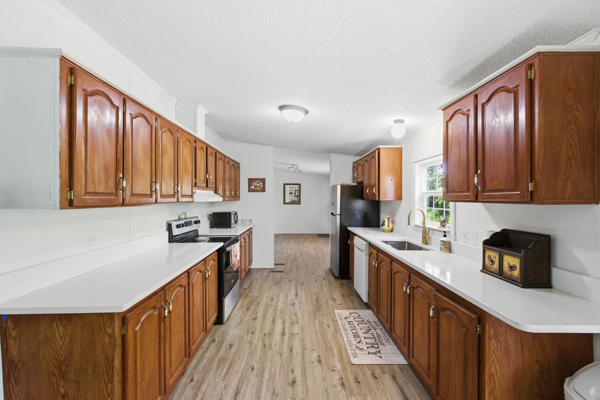 230 East Piney Road Dickson, TN 37055 - Photo 23 of 36 a kitchen with stainless steel appliances granite countertop wooden cabinets a sink dishwasher a stove and a refrigerator