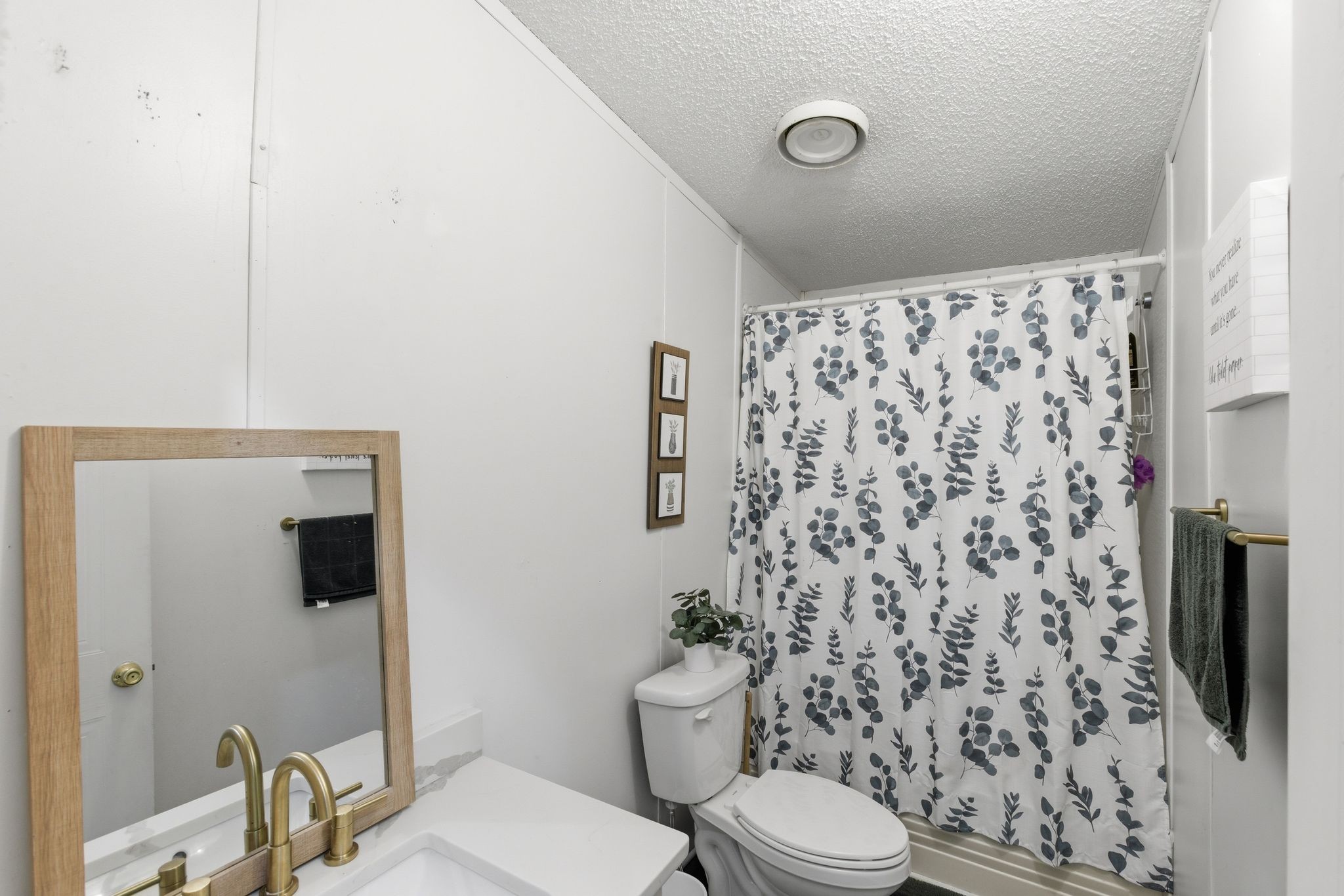 230 East Piney Road Dickson, TN 37055 - Photo 28 of 36 a bathroom with a toilet and a shower curtain