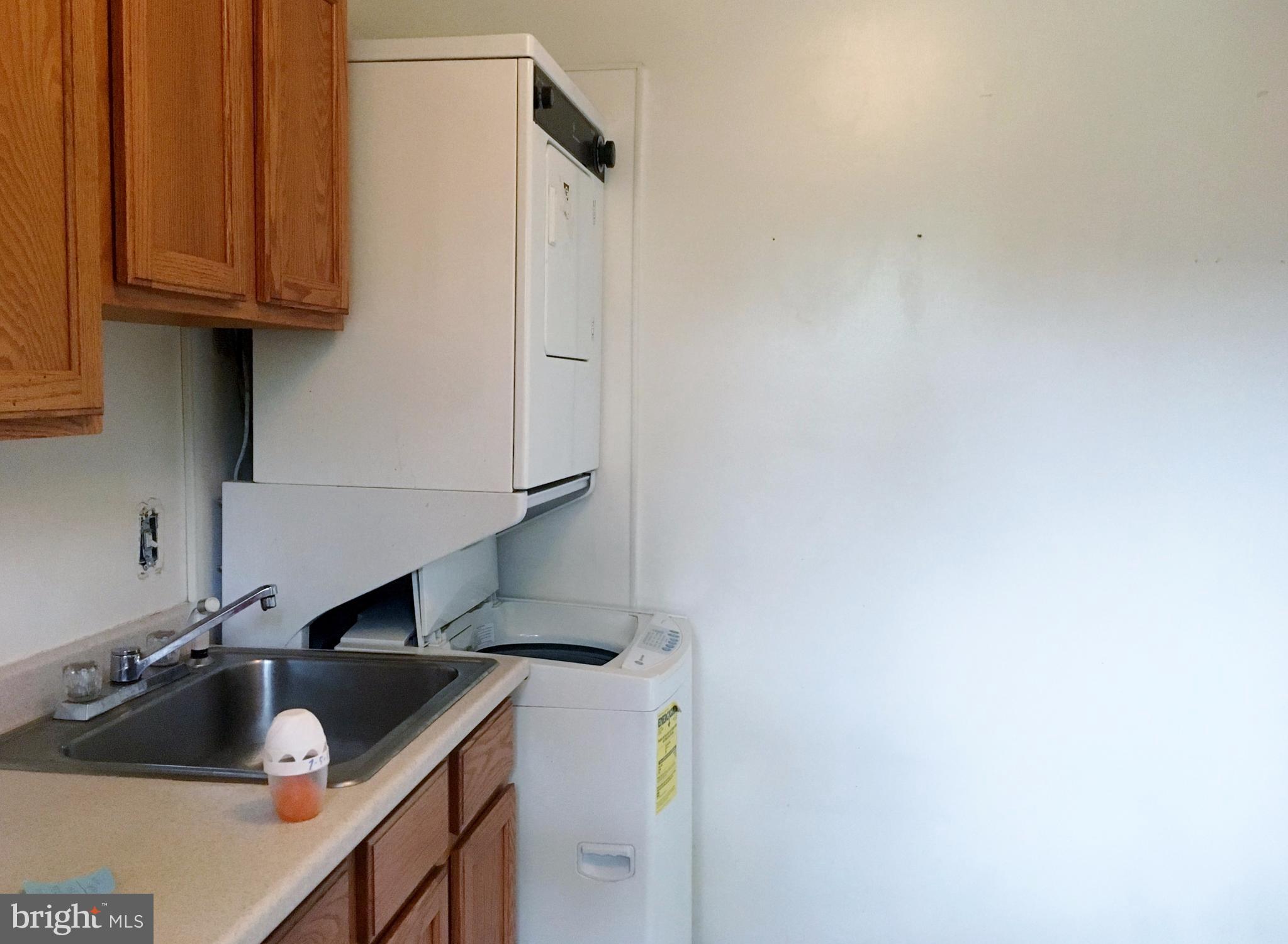 3714 Mayberry Avenue, Unit E Baltimore, MD 21206 - Photo 15 of 24 a kitchen with a sink and cabinets