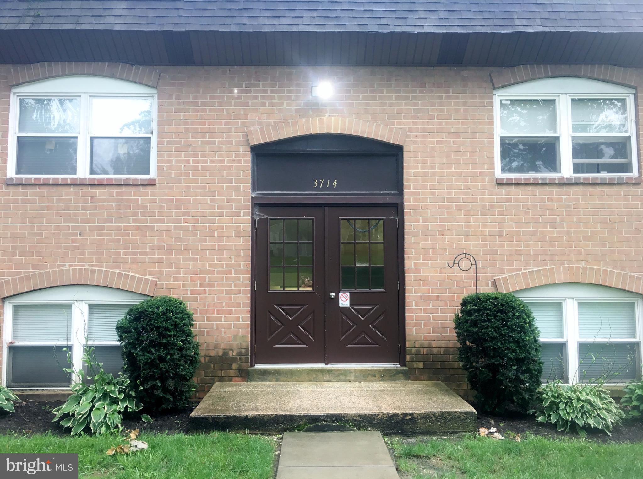 3714 Mayberry Avenue, Unit E Baltimore, MD 21206 - Photo 4 of 24 a front view of a house with a yard