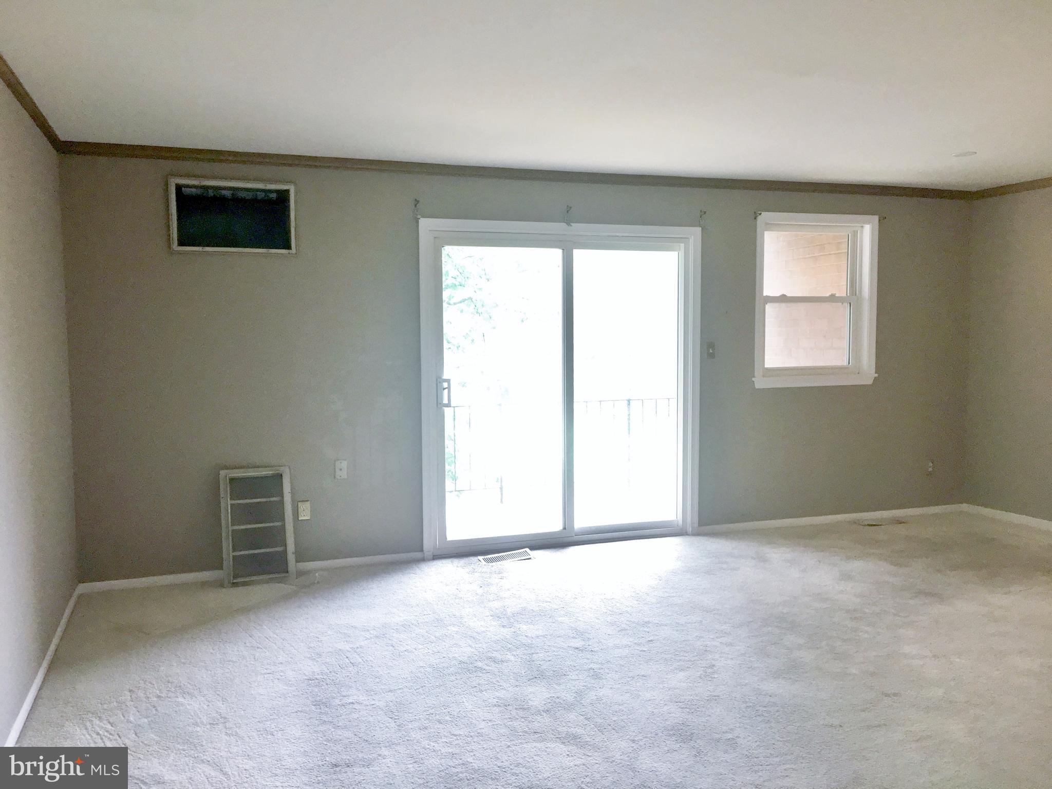 3714 Mayberry Avenue, Unit E Baltimore, MD 21206 - Photo 7 of 24 an empty room with windows