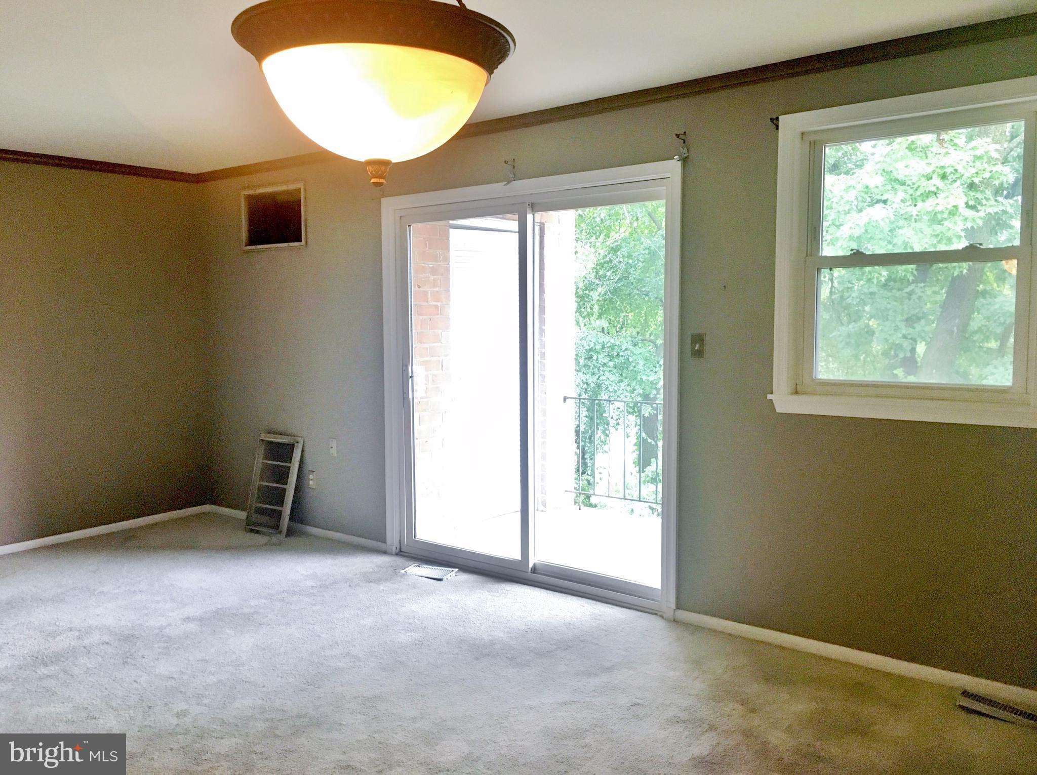 3714 Mayberry Avenue, Unit E Baltimore, MD 21206 - Photo 10 of 24 an empty room with windows