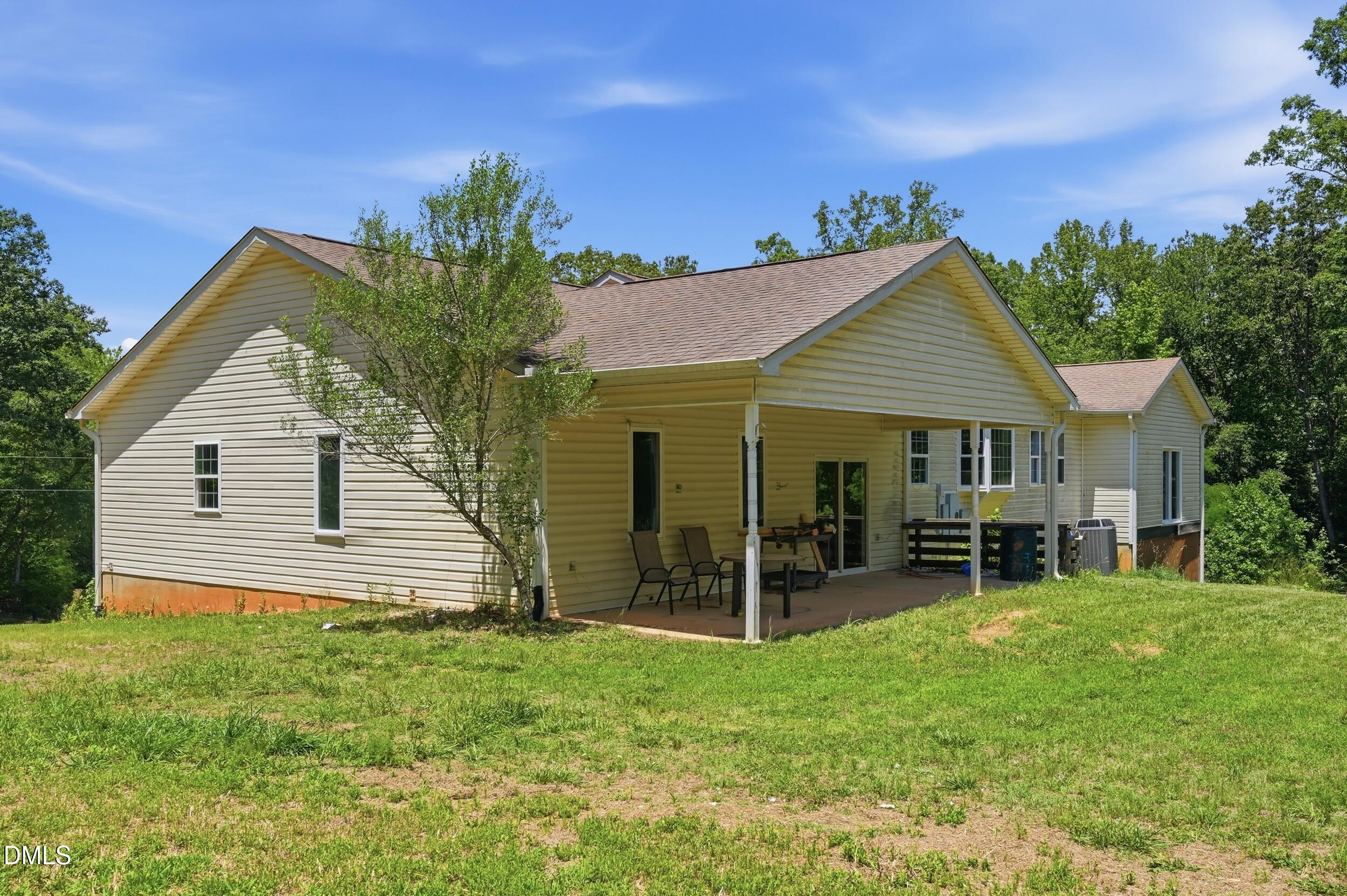 129 Shaman Drive Spring Hope, NC 27882 - Photo 29 of 43 a view of a house with a backyard