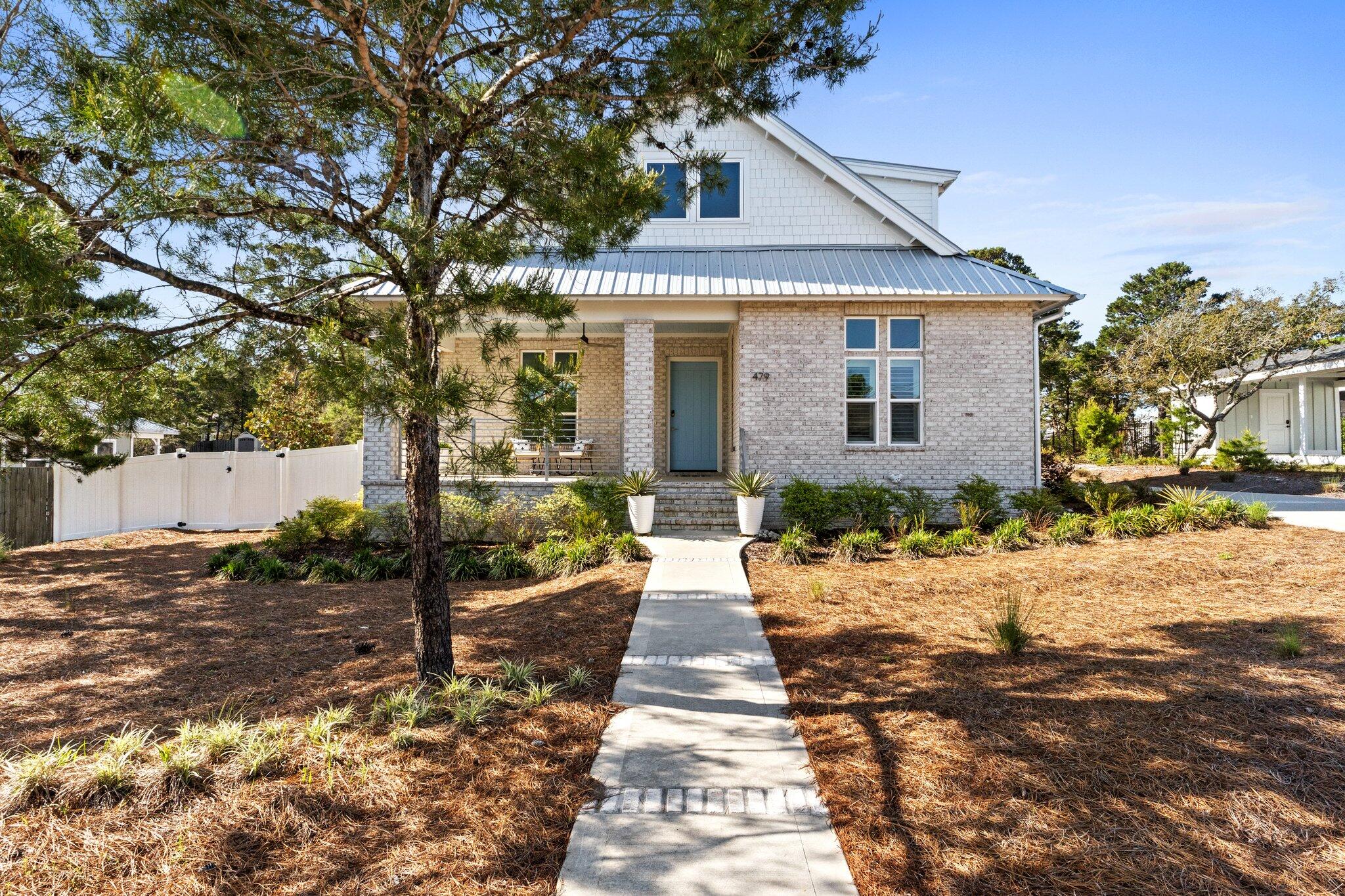 479 Ridge Road Santa Rosa Beach, FL 32459 - Photo 2 of 45 a front view of a house with a yard