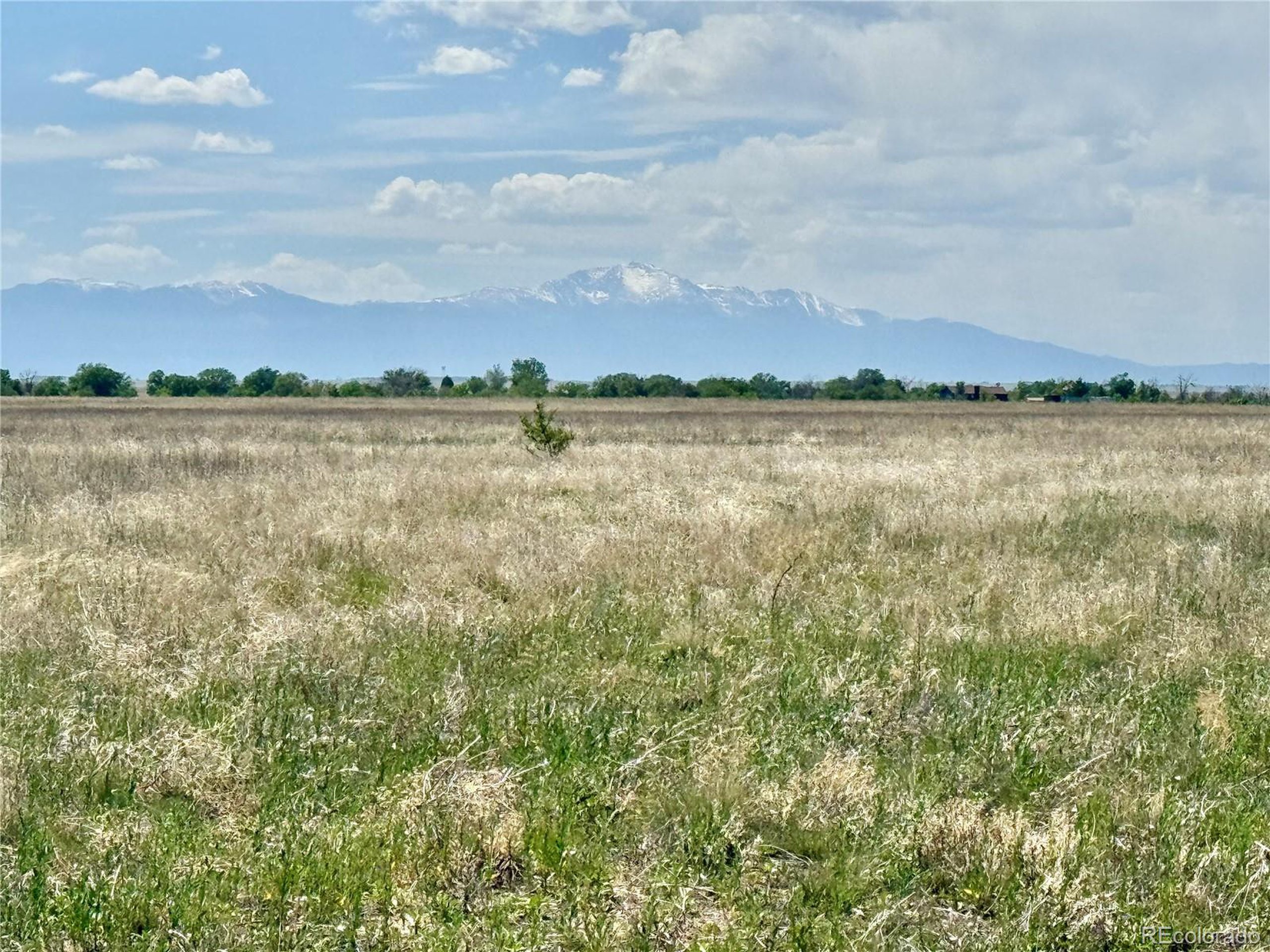 4 East Ellicott Road South Calhan, CO 80808 - Photo 11 of 13 a view of a lake and mountain in the back