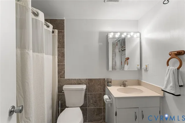 a bathroom with a toilet and a sink