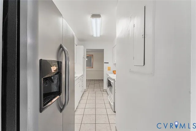 a kitchen with sink a faucet and appliances
