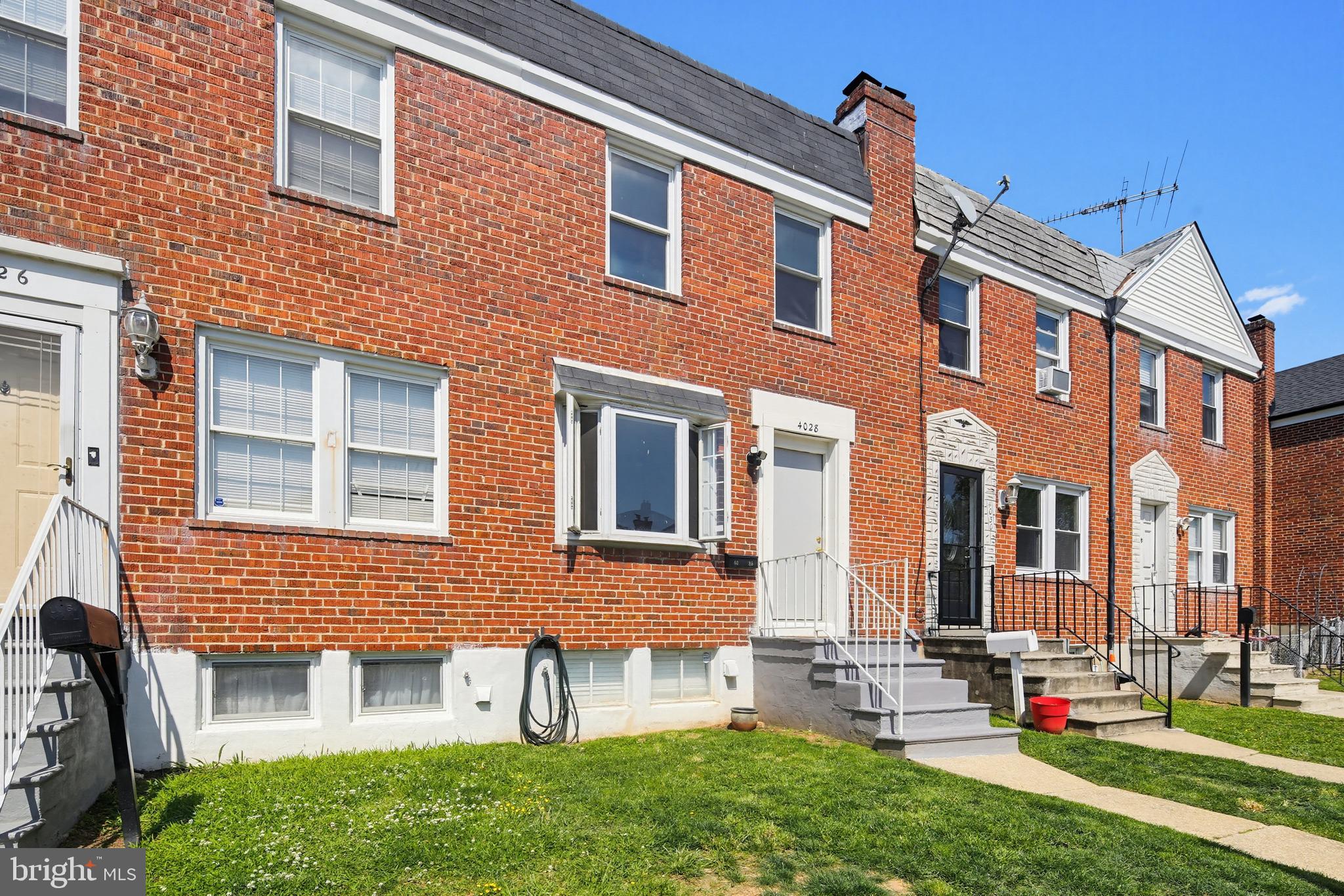 4028 Raymonn Avenue Baltimore, MD 21213 - Photo 33 of 36 Charming brick townhomes in sunlight.