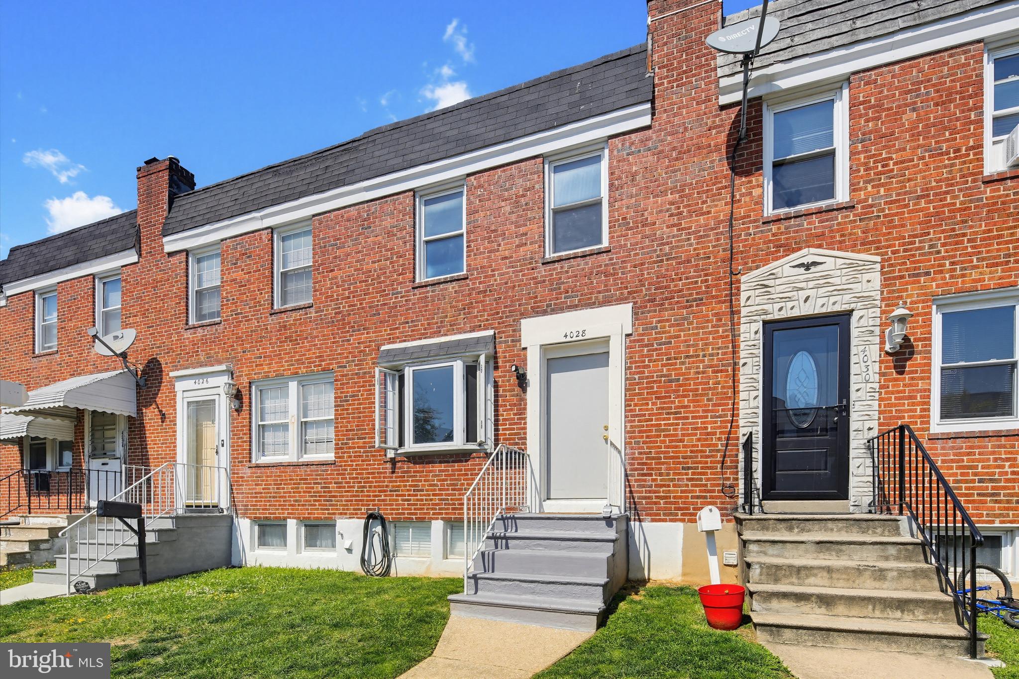 4028 Raymonn Avenue Baltimore, MD 21213 - Photo 34 of 36 Charming brick townhomes in sunlight.