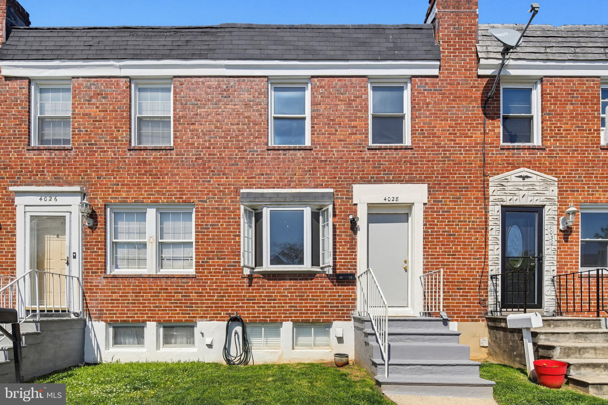 4028 Raymonn Avenue Baltimore, MD 21213 - Photo 35 of 36 Charming brick townhomes in sunlight.