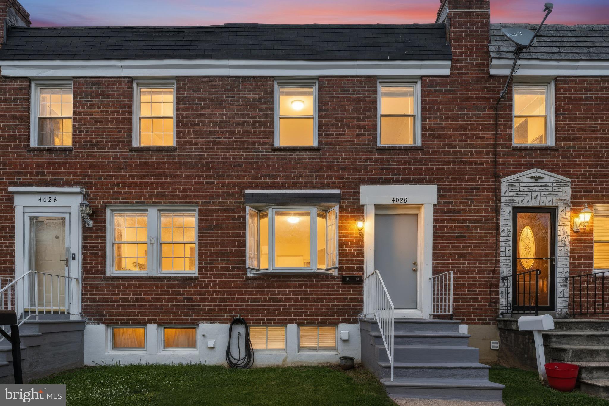 4028 Raymonn Avenue Baltimore, MD 21213 - Photo 36 of 36 Charming brick townhouse at dusk.