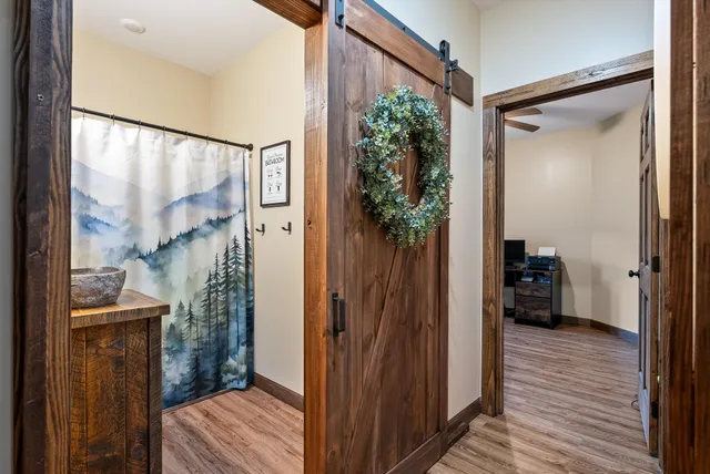 a view of a workspace with wooden floor