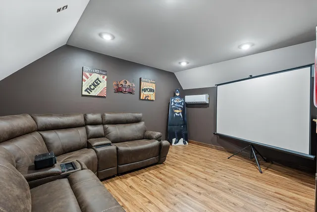 a front view of a house with a garden and yard