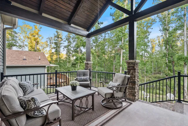 a view of backyard with a table and chairs