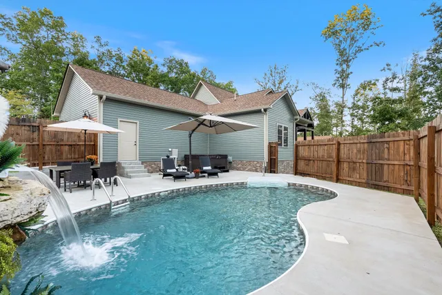 a view of a backyard with a small cabin