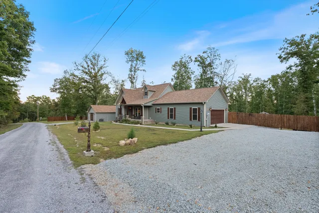 a patio with swimming pool table and chairs