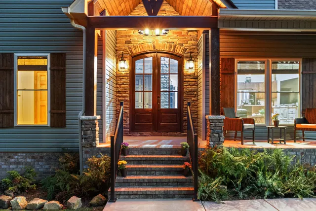 an aerial view of residential house with outdoor space and trees
