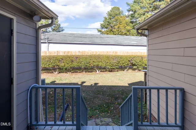 a view of a balcony with wooden floor