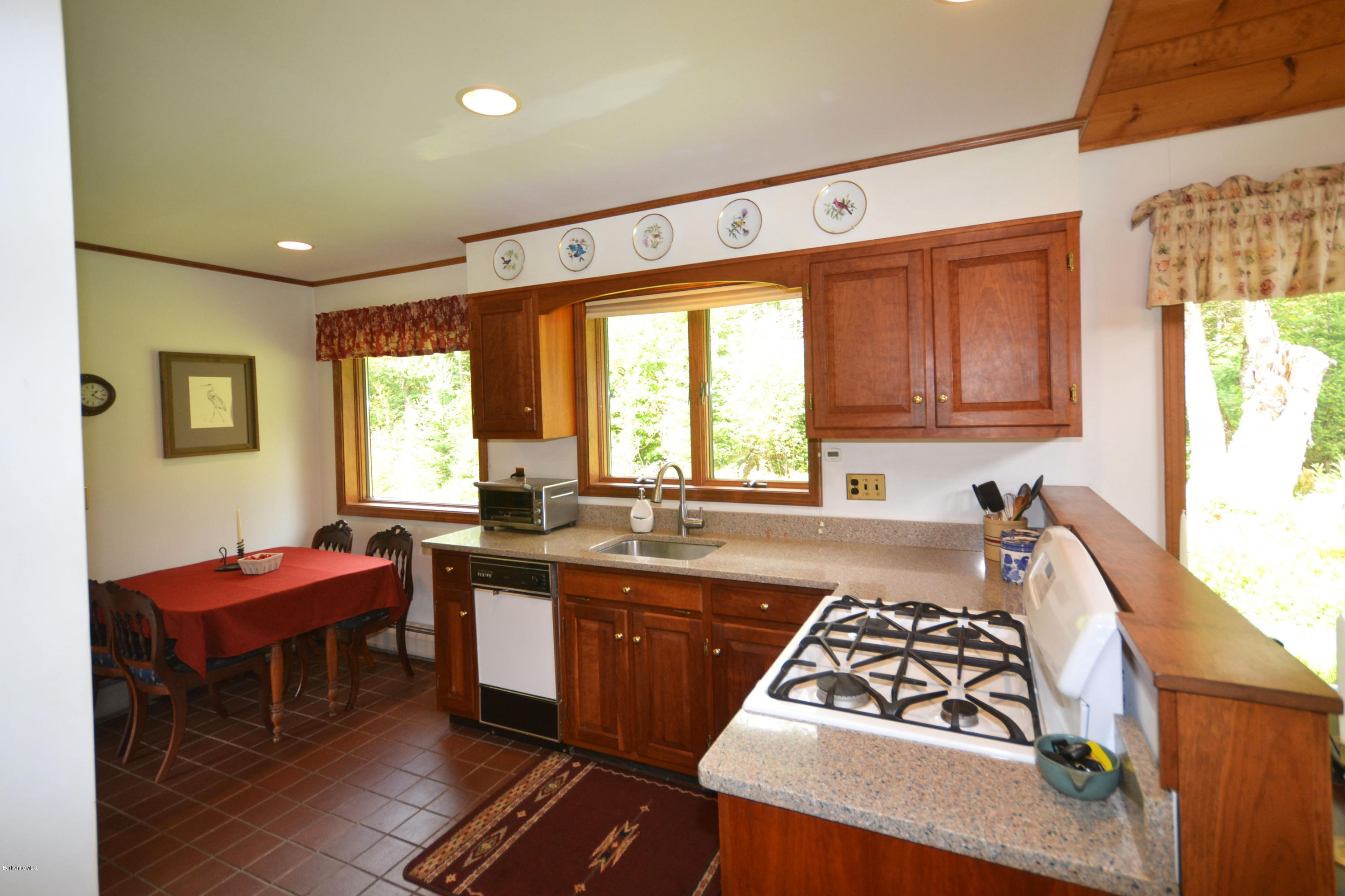 18 Baumann Road Peru, MA 01235 - Photo 13 of 52 a kitchen with a sink a window and chairs