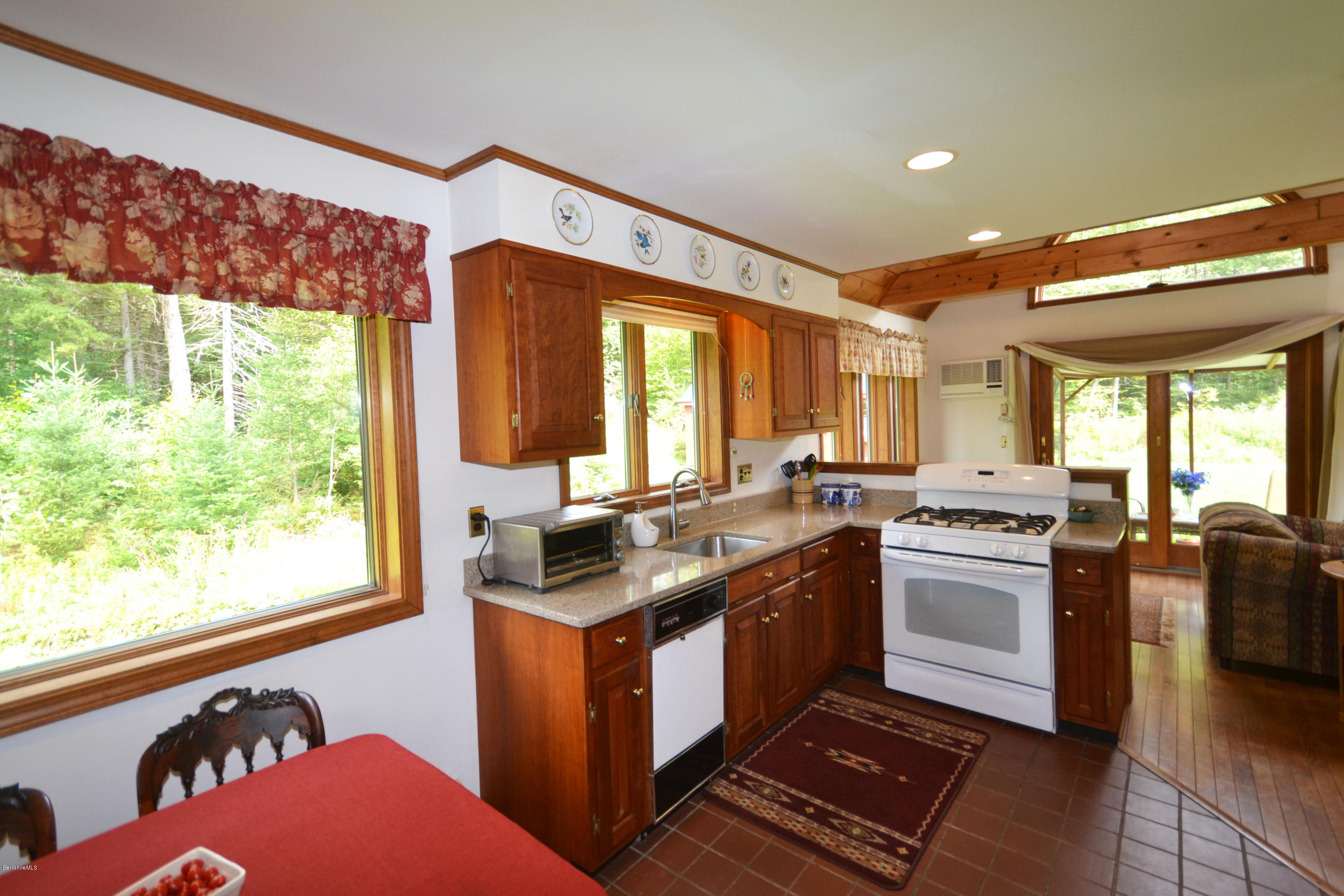 18 Baumann Road Peru, MA 01235 - Photo 15 of 52 a kitchen with stainless steel appliances granite countertop a stove a sink and a refrigerator