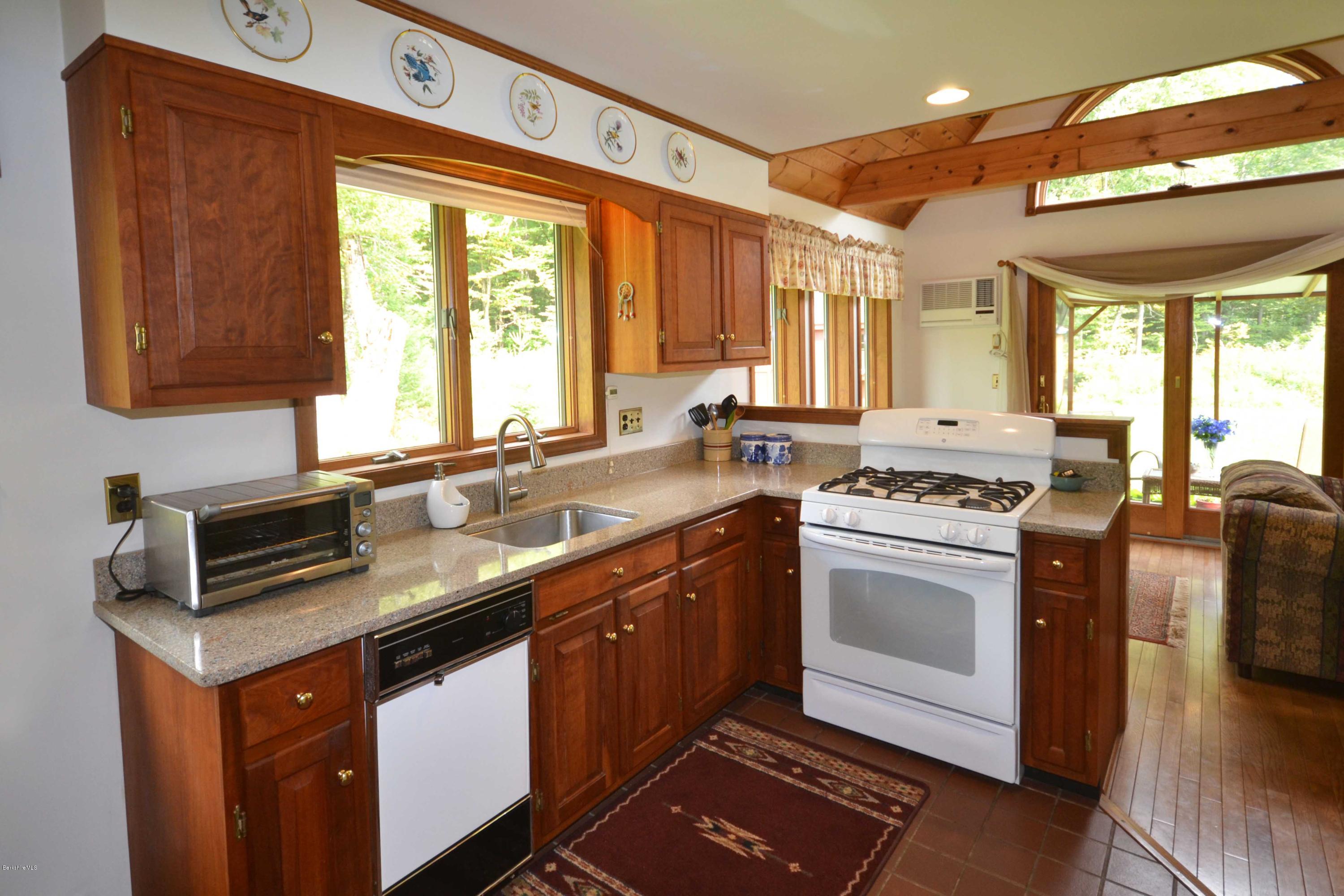 18 Baumann Road Peru, MA 01235 - Photo 16 of 52 a kitchen with a sink stove and cabinets