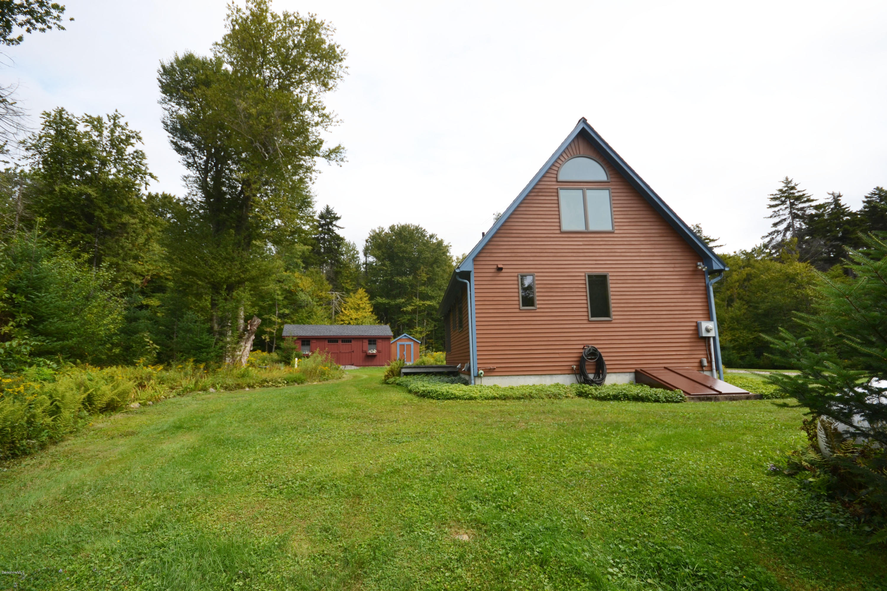 18 Baumann Road Peru, MA 01235 - Photo 44 of 52 a view of a house with a yard and sitting area