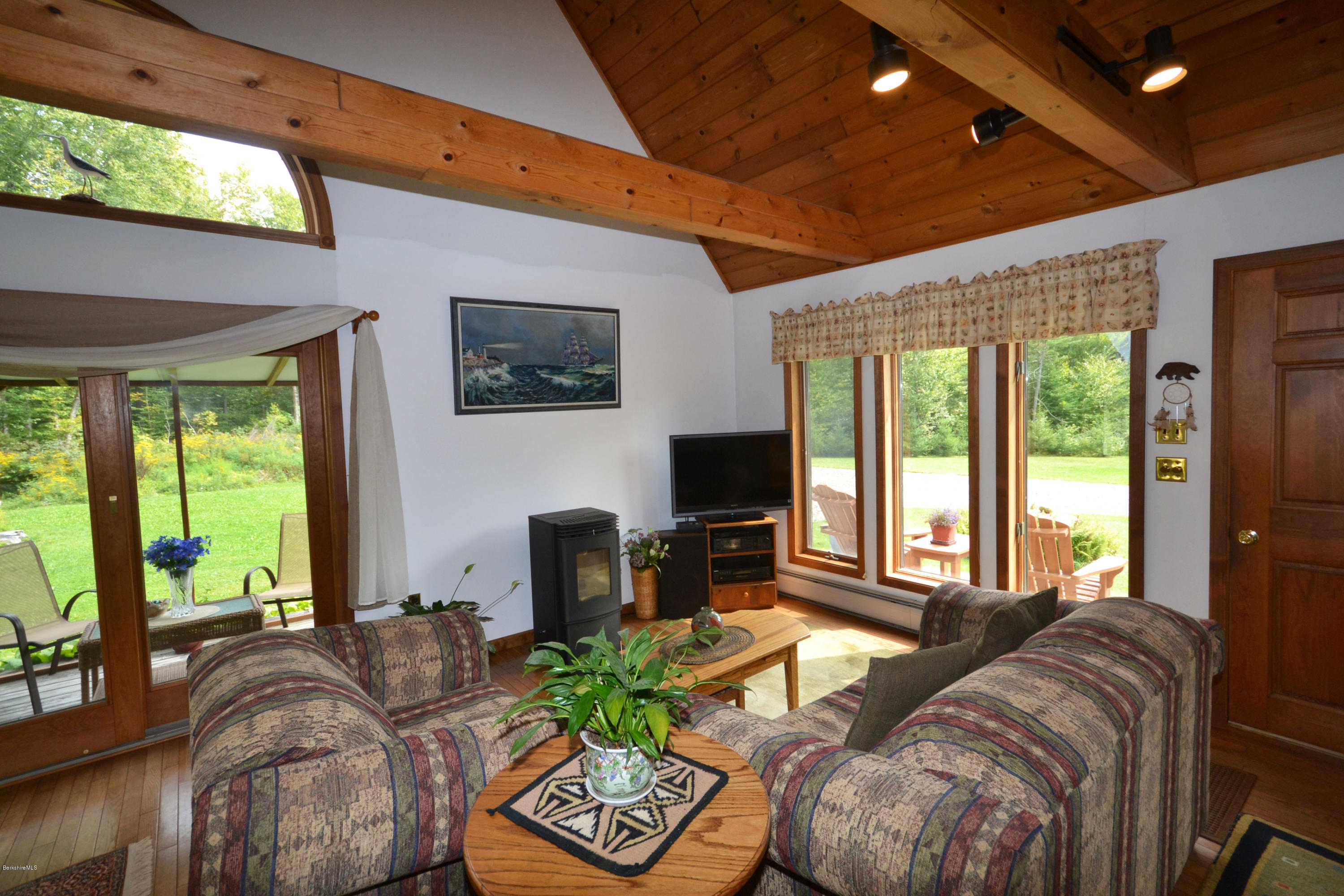 18 Baumann Road Peru, MA 01235 - Photo 9 of 52 a living room with furniture a flat screen tv and a large window