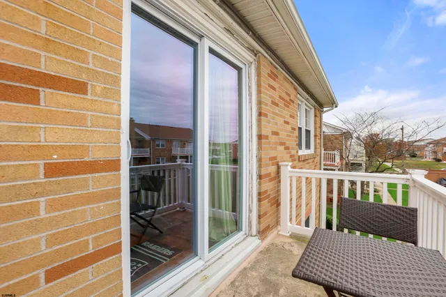 a view of a balcony with door and outdoor space