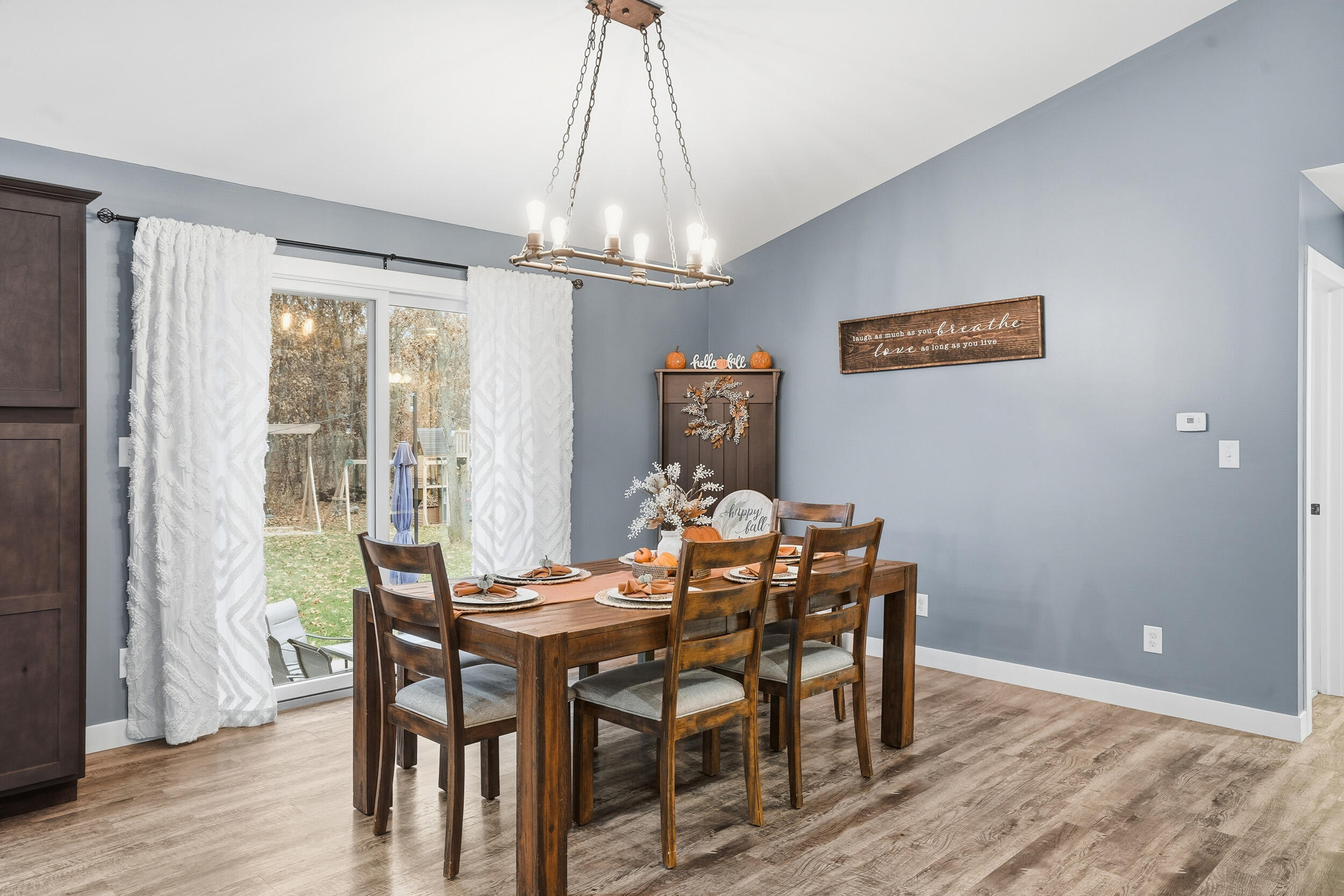 10385 Lakota Court Demotte, IN 46310 - Photo 19 of 29 a view of a dining room with furniture window and wooden floor